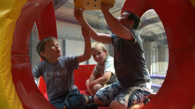 Kids playing on soft play frame at Playdome Indoor Play in Honiton