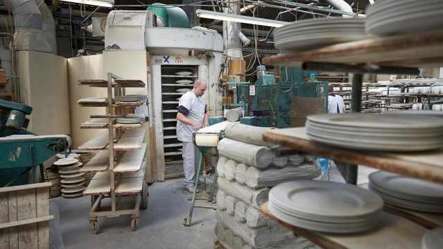 Man making ceramics at Royal Stafford Ceramic Cafe in Burslem