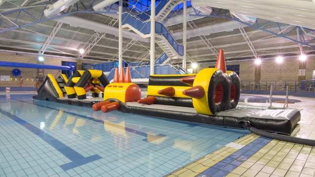 Inflatable course in swimming pool at Towcester Centre for Leisure in Towcester