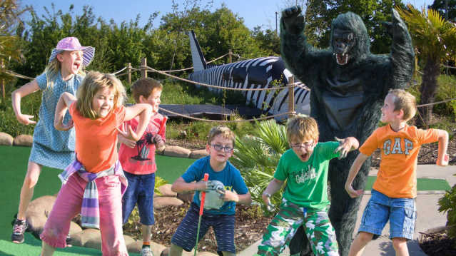 Kids playing golf at Jungle Island Adventure Golf in Epsom