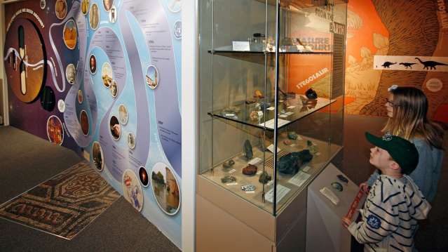 Kids looking at rock exhibit at Museum of Gloucester