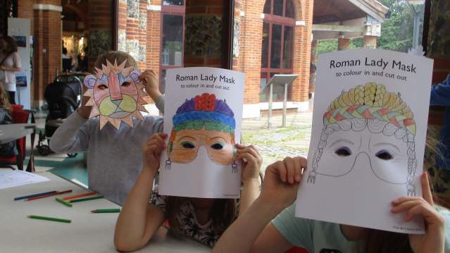 Kids with masks at Verulamium Museum in St Albans