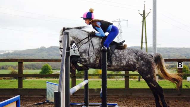 Rider and horse jumping at Penshaw Equestrian Centre in Houghton le Spring
