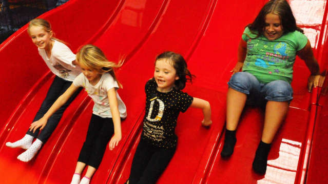 Girls on slide at Tigers Indoor Play in Daventry