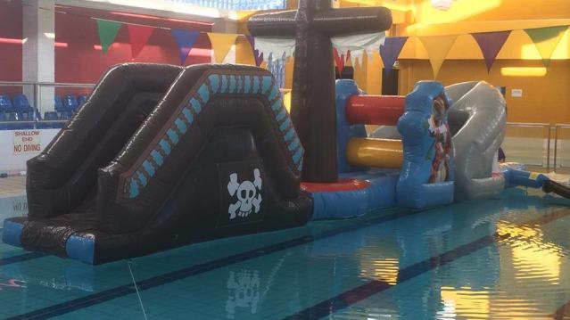 Inflatable obstacle course on swimming pool at Crystal Leisure Centre in Stourbridge 
