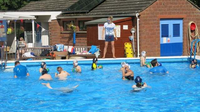 People in outdoor swimming pool at Lazonby Swimming Pool in Penrith