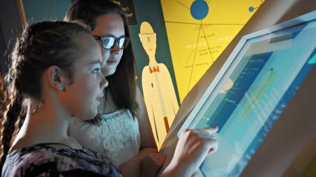 Girls on touch screen at Catalyst Science Discovery Centre in Widnes