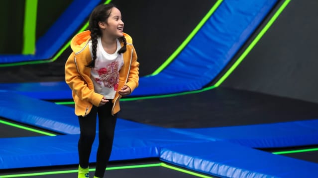 Girl jumping at Jump In Trampoline Arena
