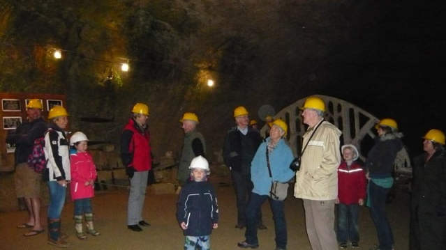 Families exploring Beer Quarry Caves