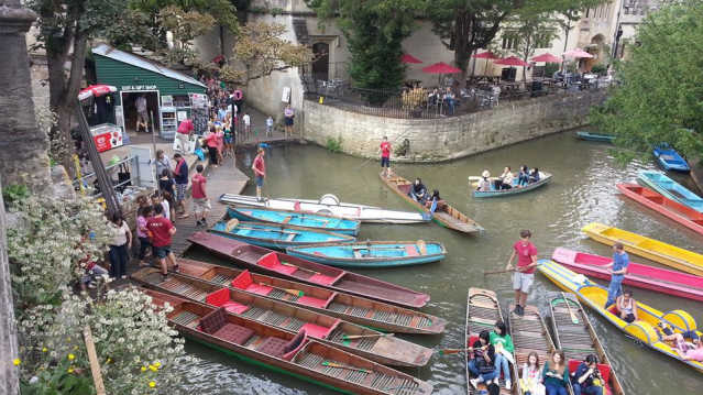 People and boats at Magdalen Bridge Row Boats in Oxford