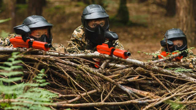 Three kids doing paintball at KidsPaintball in Leeds