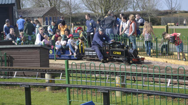 Families on train at Cutteslowe Park and Miniature Railway in Oxford