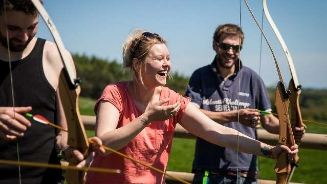 People doing archery at Live For Today Adventures Hazlewood in Tadcaster