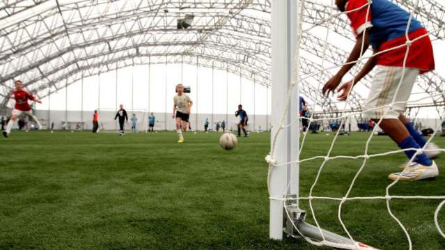 Kids playing football at Soccer Skills School in London