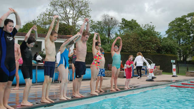 Kids diving at Sandford Parks Lido in Cheltenham