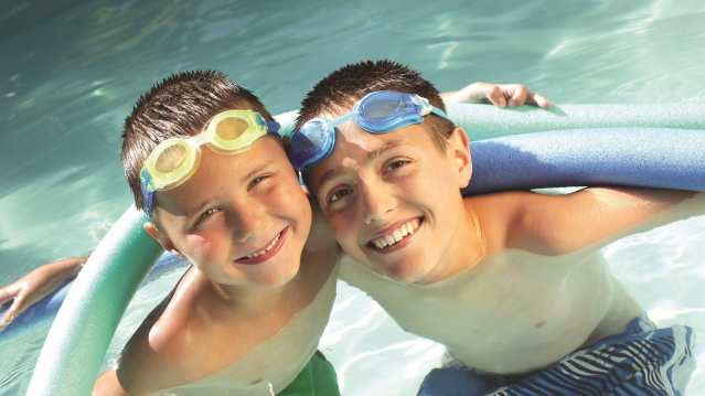 Boys in swimming pool at Brentford Fountain Leisure Centre