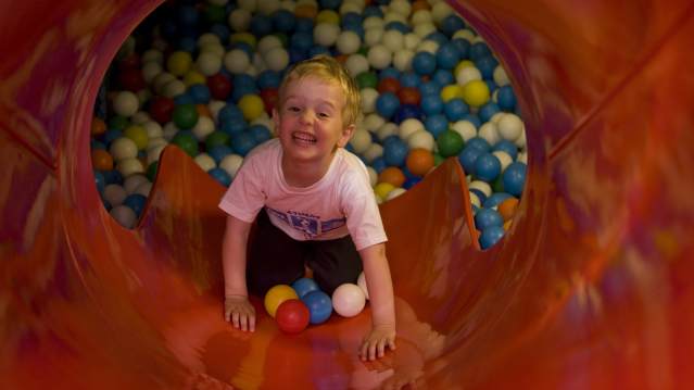 Boy on slide at Speckys Pirate Ship in Guildford