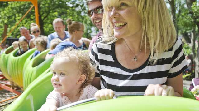 Family on Wriggler rollercoaster ride at Gullivers World in Warrington