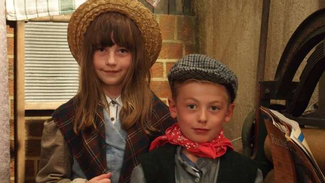 Kids dressed as mine workers at National Mining Museum Scotland in Newtongrange