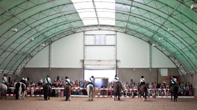 Riders and horses in dressage competition at Aldersbrook Riding School in London