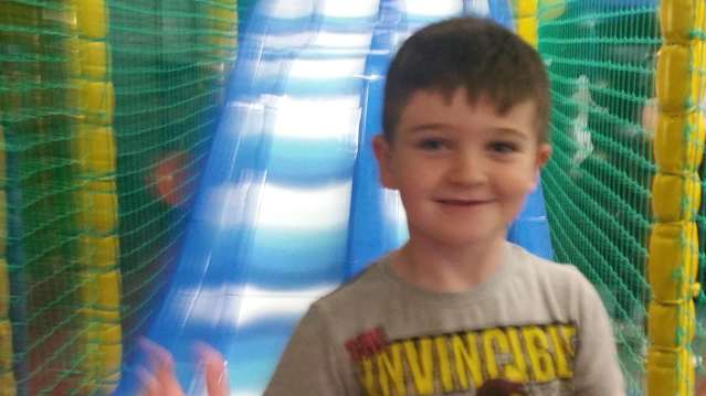 Boy on slide at Ruff and Tumble in Glasgow