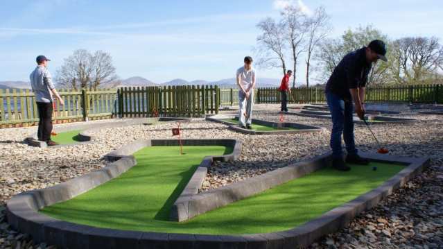 People playing crazy golf at Star Outdoors Kenmare