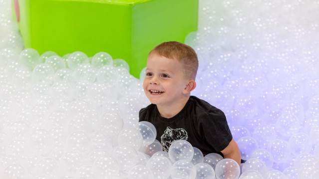 A little boy playing in some bubbles at Newquay Trampoline Park