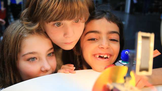 Kids look at invention in Museum of Science and Industry in Manchester