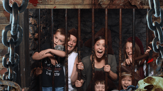 Family in cell at The Clink Prison Museum in Southwark