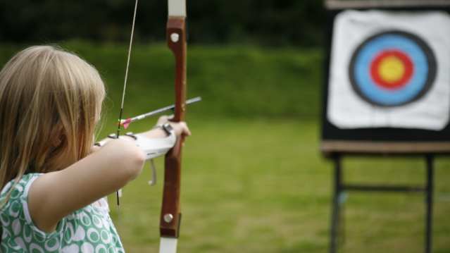 Girl doing archery at Stay Active Adventures in Newquay