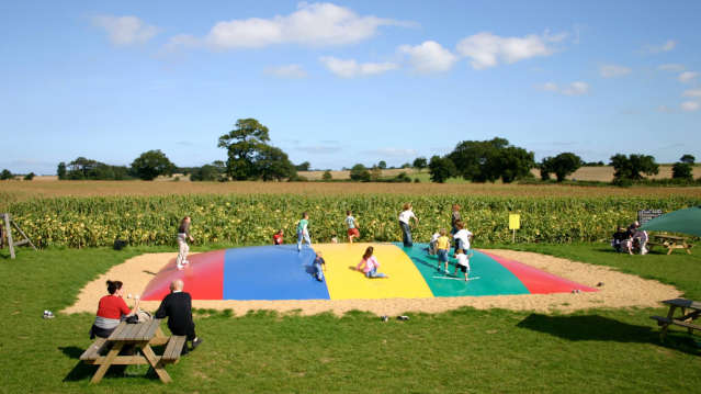 Kids playing on jumping pillow at Wizard Maze in Metton
