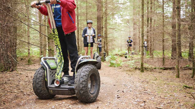 Kids riding on wheely scooters at Go Ape Bracknell