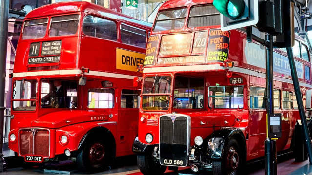 Two historic red Routemaster buses on show at the London Transport Museum in Covent Garden.