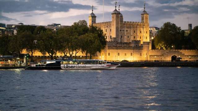 uber boat in the evening sailing in front of castle