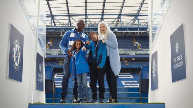 Chelsea FC tour guide leading visitors through Stamford Bridge, sharing club history and behind‑the‑scenes stories.