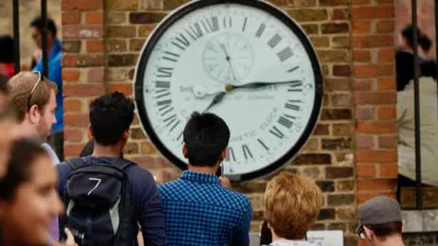 Visitors viewing the historic Shepherd Gate Clock at Royal Observatory Greenwich