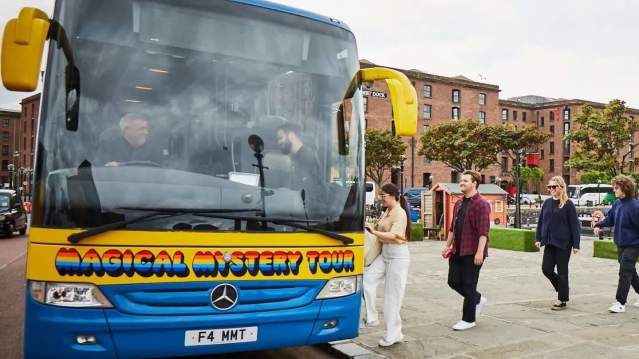 Passengers boarding the Magical Mystery Tour coach at Albert Dock, Liverpool.