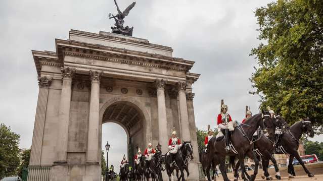 Changing of the Guard on horseback passing through Wellington Arch in London
