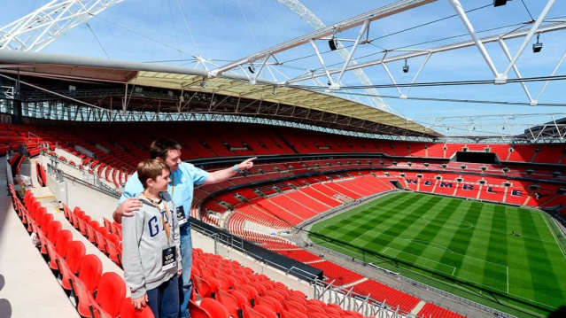 Father and son enjoying the Panoramic views of Wembley Stadium