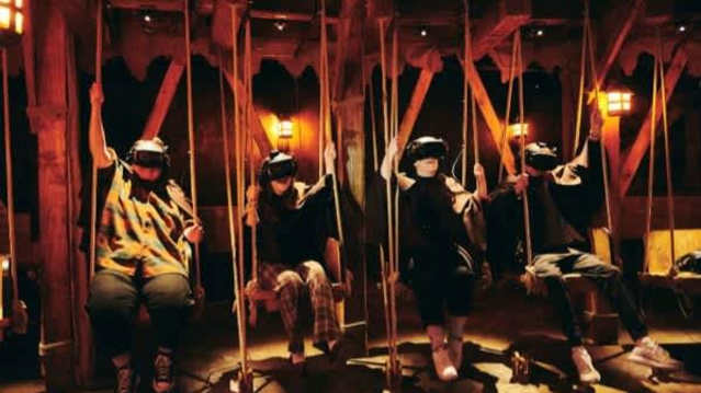Guests wearing VR headsets swing in sync as part of the Jeff Wayne’s War of the Worlds virtual reality segment, included with Jeff Wayne’s War of the Worlds tickets.