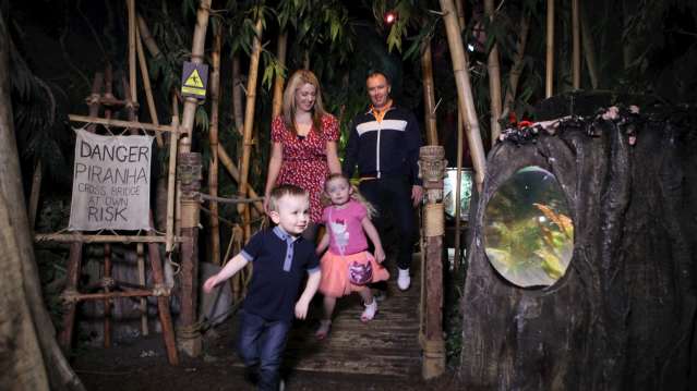 family walking through sea life