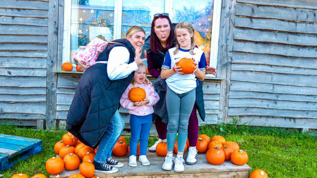A family picking pumpkins at Wynford Farm Park, Aberdeen